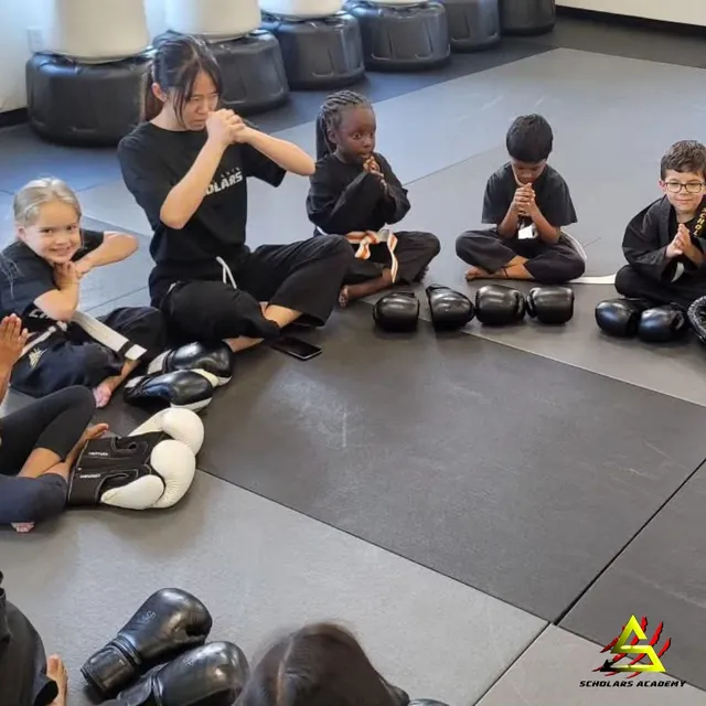 Children practicing focus and discipline in a martial arts class at Scholars Academy in Brentwood, CA Children practicing focus and discipline in a martial arts class at Scholars Academy in Brentwood, CA