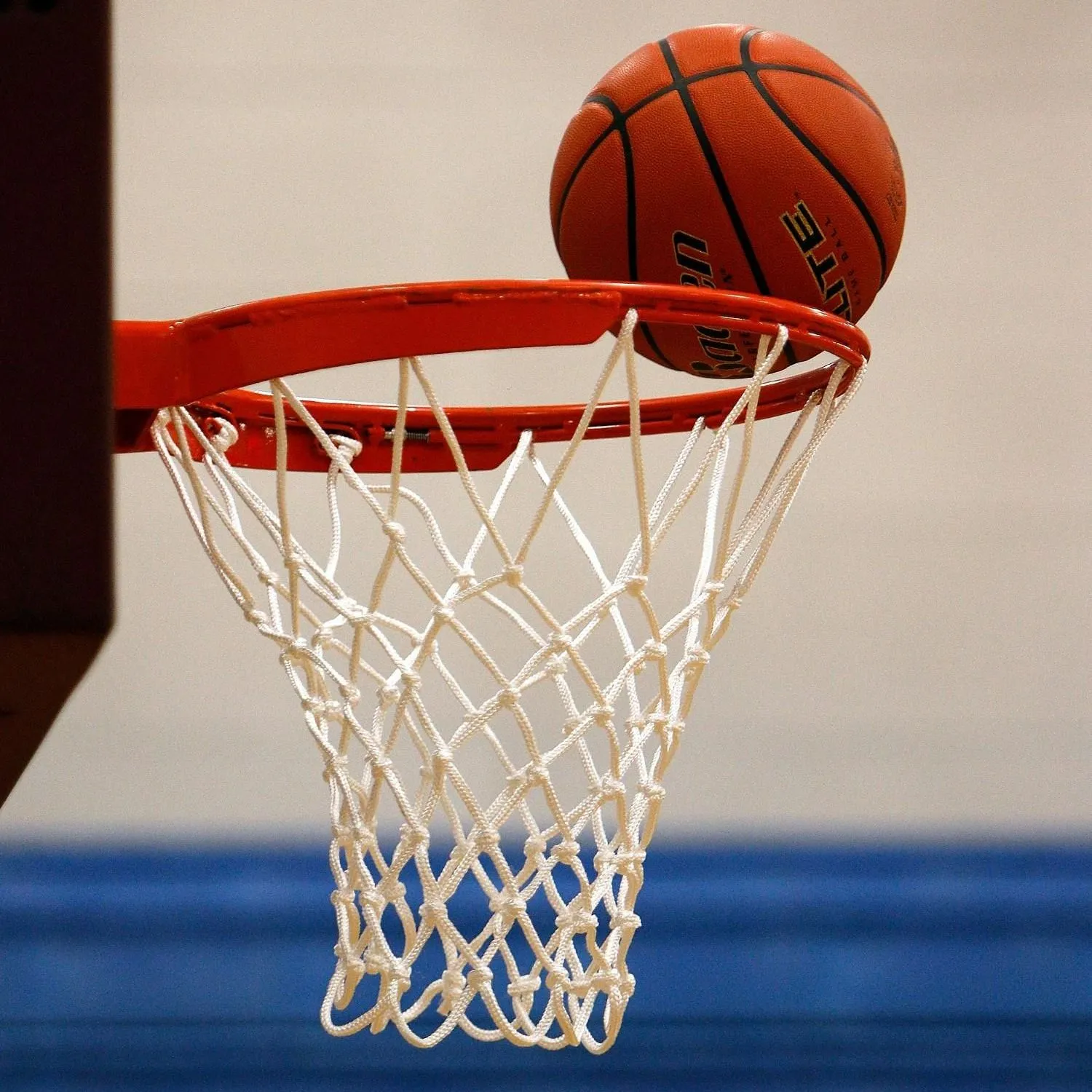 Basketball dropping through the net during a youth basketball class in Brentwood, CA Basketball dropping through the net during a youth basketball class in Brentwood, CA
