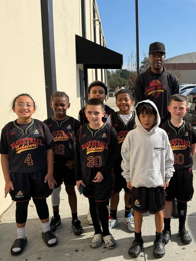 Young Scholars Academy basketball players and their coach outside the Brentwood, CA gym Young Scholars Academy basketball players and their coach outside the Brentwood, CA gym