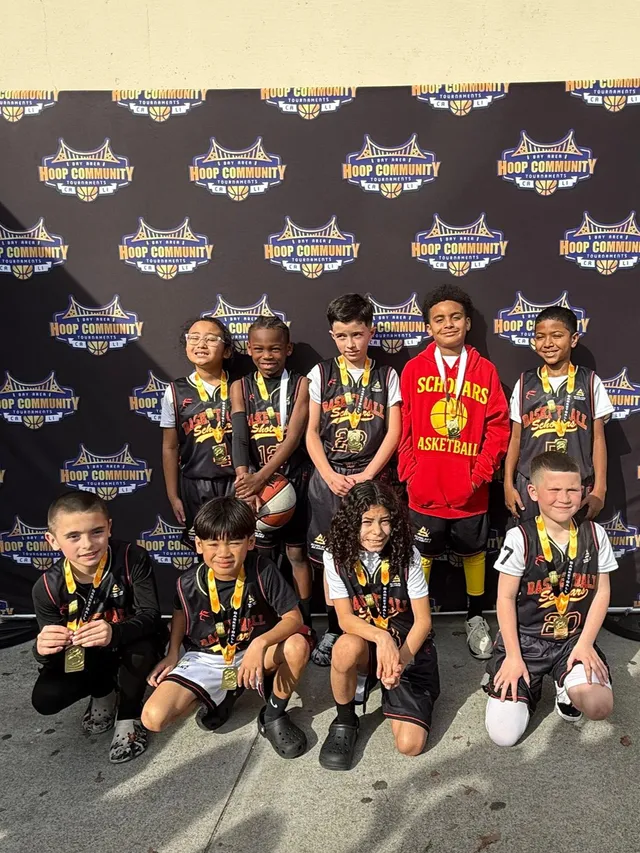 Scholars Academy youth basketball team wearing medals after a Hoop Community tournament in Brentwood, CA